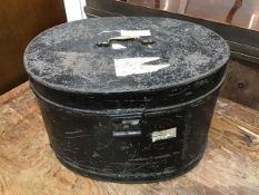 A 19thc oval tole hatbox, the top with brass swan neck handle, with green painted interior by John