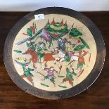 An early 20thc Japanese crackleware plate depicting a battle scene, with brown border (d.36cm)