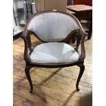 An Edwardian upholstered walnut frame armchair, with sweeping top rail, upholstered back and seat,