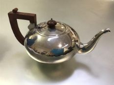 A George V silver teapot, maker's mark TJ, Birmingham 1932, of compressed spherical form, with