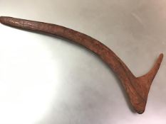 An Aboriginal spurred boomerang, Australia, with planished finish (repaired). 74cm