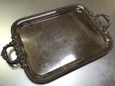A substantial 19th century silver-plate on copper twin-handled tray, of rectangular form, with