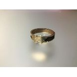 A late Victorian 9ct yellow gold mourning ring, the central cartouche-shaped plaque engraved with
