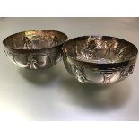 A pair of Egyptian silver bowls, c. 1930, each decorated with cartouches of Pharaonic figures,