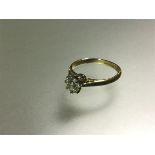 A single stone diamond ring, the round brilliant-cut stone weighing 0.65 carats, claw-set in
