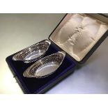 A pair of Edwardian cased silver sweetmeat or bon bon baskets, Atkin Brothers, Sheffield 1907, of