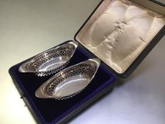 A pair of Edwardian cased silver sweetmeat or bon bon baskets, Atkin Brothers, Sheffield 1907, of