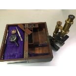 A French lacquered gilt brass monocular microscope, Hartnach & Prazmouski, Rue Bonaparte, Paris,