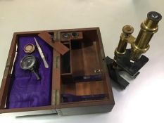 A French lacquered gilt brass monocular microscope, Hartnach & Prazmouski, Rue Bonaparte, Paris,