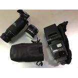 A Leica Extender-R 2x (lens extender), in a carry bag; together with a Metz 54 MZ-4i standard