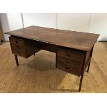 Arne Vodder, A Danish rosewood desk, c. 1960, manufactured by Sibast, the floating rectangular top