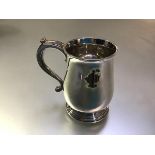 A substantial George V cast silver tankard, Heming & Co., London 1929, in 18th century style, of
