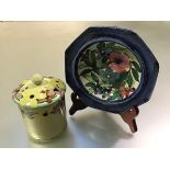 Strathyre Pottery: a preserve jar by Mary A. Ramsay, painted with flowers against a yellow ground,