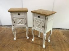 A pair of French white-painted bedside cupboards, in the Neo-Classical taste, each with