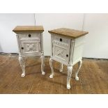 A pair of French white-painted bedside cupboards, in the Neo-Classical taste, each with