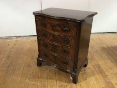 A mahogany serpentine chest of George III design, first half 20th century, the crossbanded top above