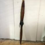A decorative copy of a vintage laminated wooden propellor. Length 188cm
