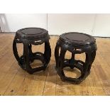 A pair of Chinese hardwood barrel-form stands, 20th century, each with beaded rim and pierced shaped