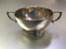 A George V silver twin-handled bowl, London 1925, of tapering form, chased with concentric bands.