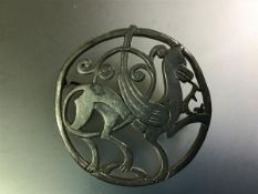 A vintage Shetland Silvercraft silver "Nordic" brooch, circular, modelled with a mythical beast,
