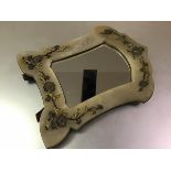 A 19th century gilt-metal mounted alabaster dressing table mirror, the cartouche shaped mirror plate