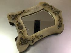 A 19th century gilt-metal mounted alabaster dressing table mirror, the cartouche shaped mirror plate