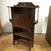 A Glasgow School writing desk c.1900, the pierced back incorporating an open recess and hinged