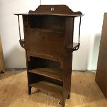 A Glasgow School writing desk c.1900, the pierced back incorporating an open recess and hinged