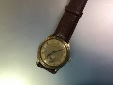 A vintage Longines gentleman's wristwatch, c. 1950-60, the two tone gilt dial with Arabic numerals