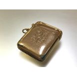 An Edwardian 9ct gold vesta case, Birmingham 1903, of characteristic form, engraved with a monogram.