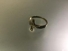 A 9ct gold ecclesiastical ring, Lister & Wright, Birmingham 1979, the band modelled with a figure of
