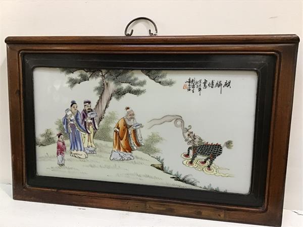 Chinese School, a painted porcelain panel depicting a qilin breathing smoke with a sage and other