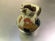 Maureen Minchin (British, b. 1954) a studio pottery hand painted earthenware jug decorated with
