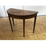 A 19th century mahogany and boxwood lined side table, of semi-elliptical form, the crossbanded top