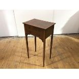 An Edwardian satinwood crossbanded mahogany bedside table, the rectangular top above two short and