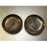 Two Chinese coin-inset silver dishes, early 20th century: the first with a Hsuan Tung dollar