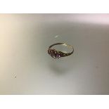 A late Victorian four stone amethyst ring, collet set with a pair of round cut and a pair of