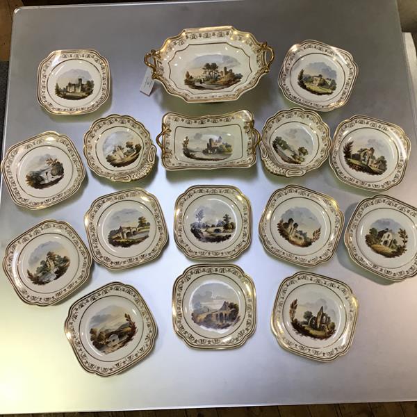 A Spode dessert service, mid-19th century, each piece painted to the well with an architectural or