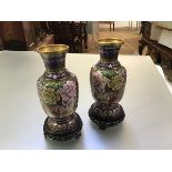 A pair of Chinese cloisonne enamel vases, 20th century, of baluster form, with decoration of