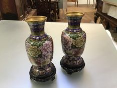 A pair of Chinese cloisonne enamel vases, 20th century, of baluster form, with decoration of