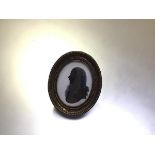 English School, late 18th century, a portrait silhouette of a gentleman, with lace stock, oval, in a