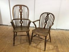 A 19th century elm Windsor armchair, the hoop shaped back with pierced splat and turned spindles