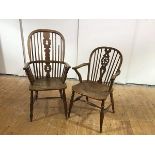 A 19th century elm Windsor armchair, the hoop shaped back with pierced splat and turned spindles