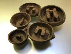 A group of five Ancient Chinese Period carved wooden "buffalo" bowls, the well of each carved with a