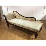 A Victorian rosewood day bed, the undulating back and scroll arm upholstered in a gold patterned