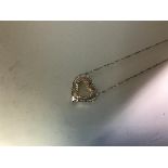 A diamond-set heart pendant, the open heart set to the exterior in white gold with a line of small