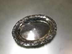 A German 800 silver trinket dish, c. 1900, oval, the rim chased with c-scrolls and with a