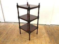 A late George III mahogany whatnot, the three tiers with baluster turned supports, cone finials