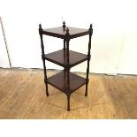 A late George III mahogany whatnot, the three tiers with baluster turned supports, cone finials