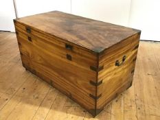 A large camphorwood and brass-bound trunk, second half 19th century, the rectangular hinged top with
